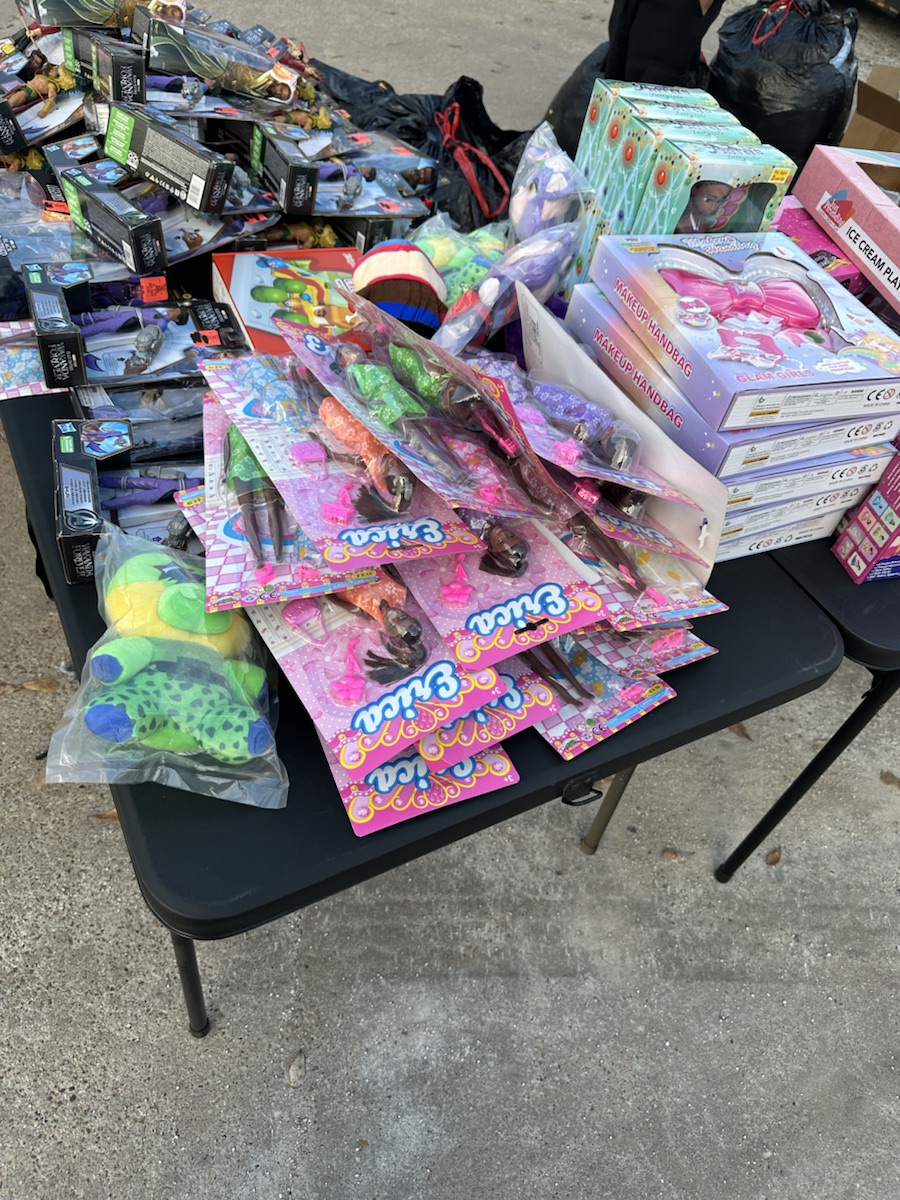 Tables filled with donated toys for a community giveaway